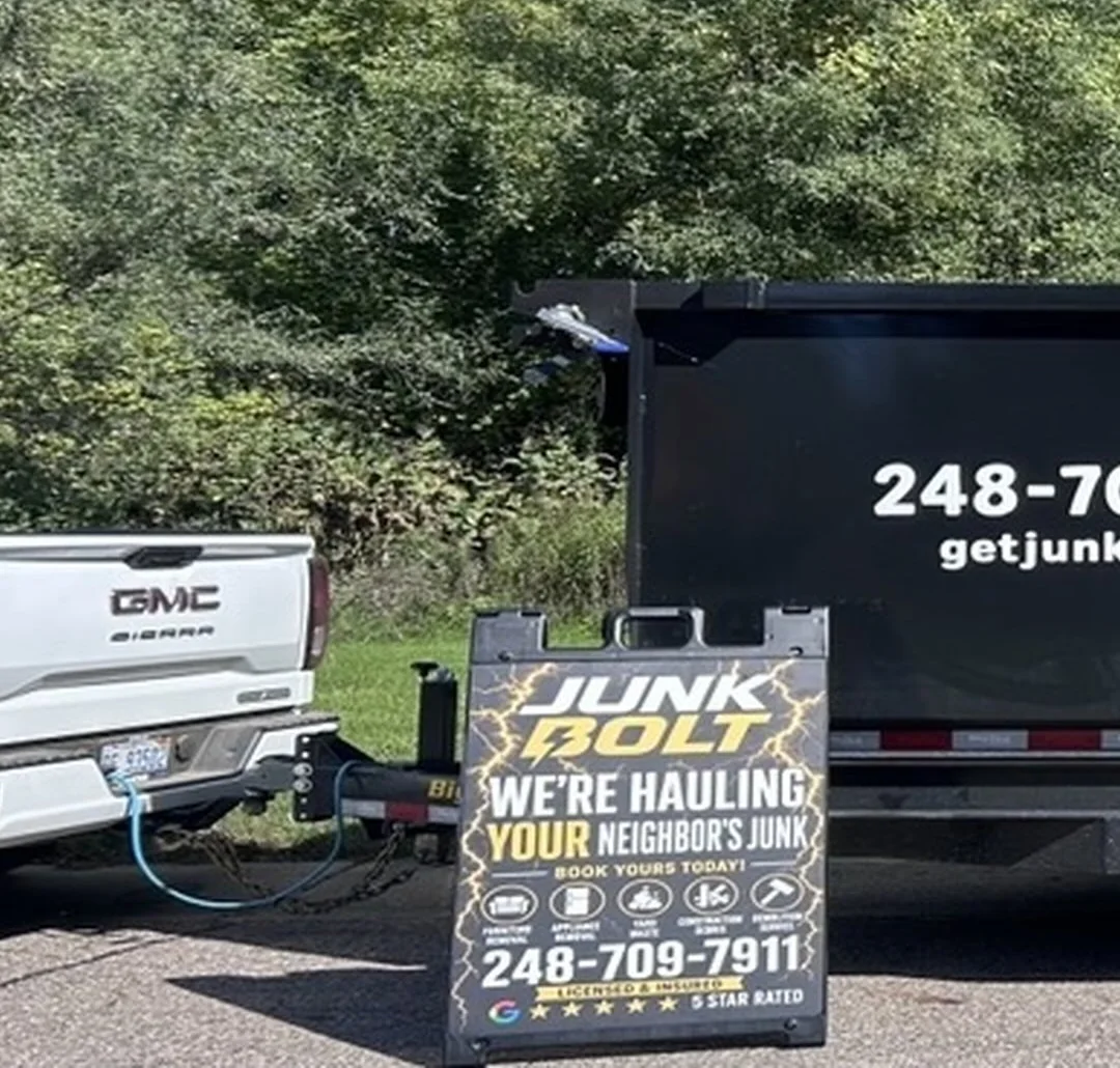The real Junk Bolt truck and branded dump trailer.